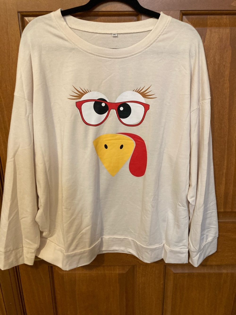 Cream Graphic Turkey Face Pullover Sweatshirt